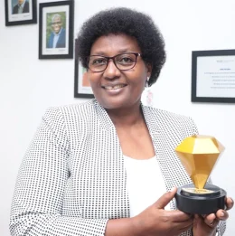 Ms. Lydia Nyesigomwe